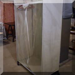 Z01. Rolling clothing storage rack.